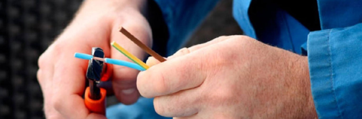 An electrician connecting wires together